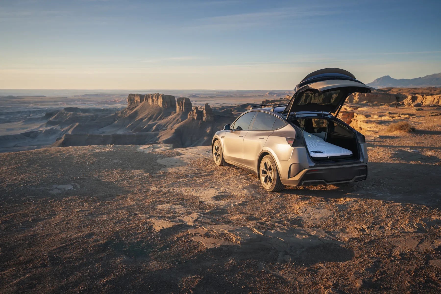 Open crossover with a white mattress at a desert overlook