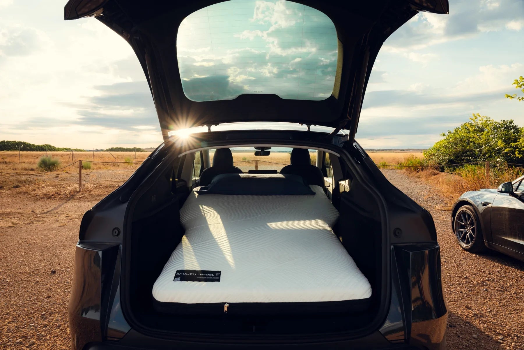Snuuzu mattress installed across the rear sleep space of a Tesla Model Y