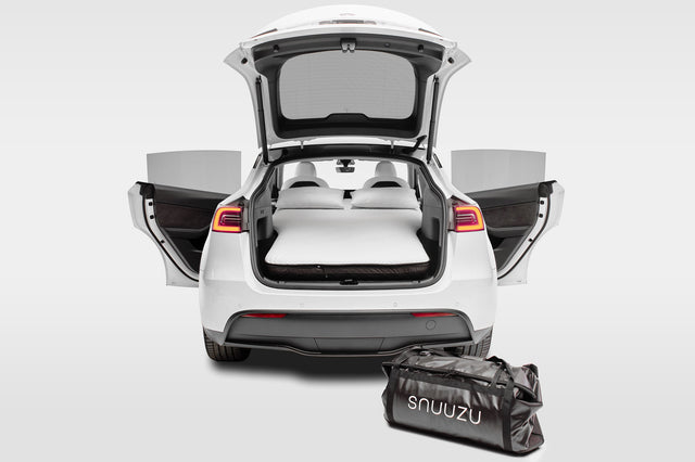 Snuuzu Tesla Model Y car camping mattress fully installed with rear trunk open showing complete sleeping setup and integrated storage bag