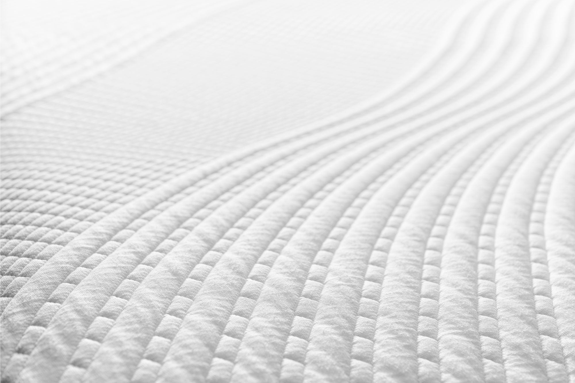 Close-up of the Snuuzu Tesla camping mattress Tencel fabric showing the quilted breathable surface pattern