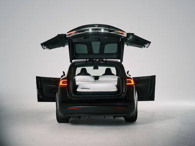 Snuuzu Tesla Model X car camping mattress shown fully set up for sleeping, designed for perfect fit and comfort during road trips and camping.
